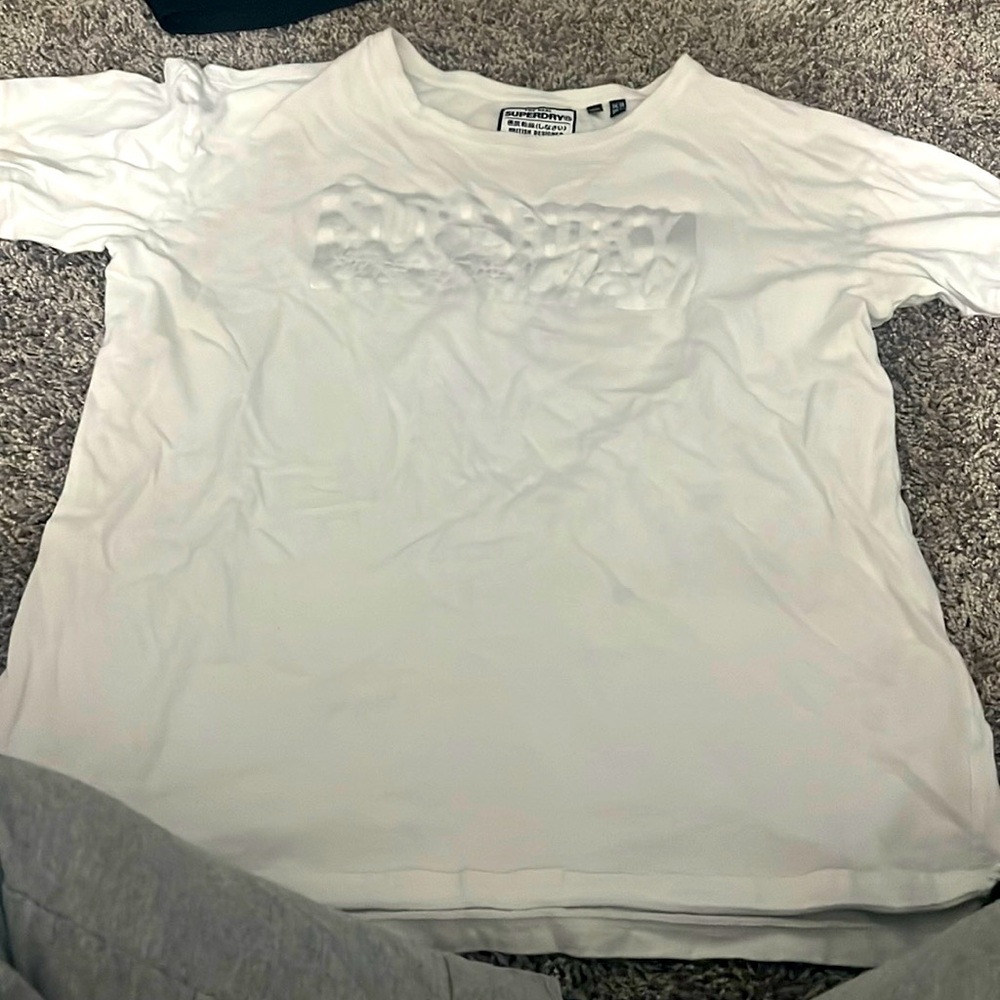 White and silver tee.